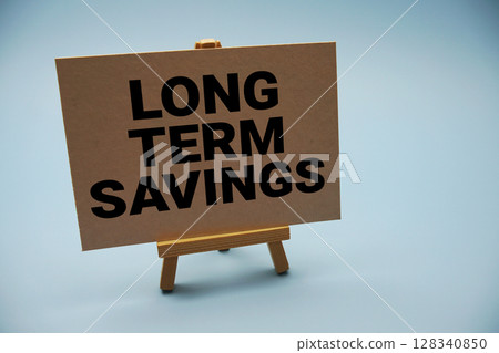 Long-Term Savings text and piggy bank for saving on blue background 128340850