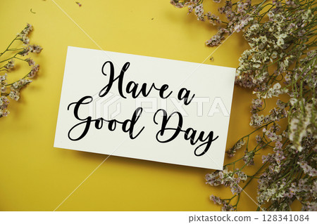 Have a Good Day text with flowers decoration on yellow background Have a Good Day text with flowers decoration on yellow background 128341084