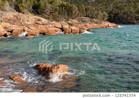 Red rocks and blue-green water - Coles Bay 128341354