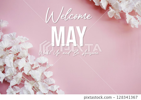 Welcome May Wake Up and be Awesome text with flowers decorations on pink background 128341367