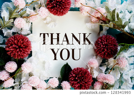 Thank You text with flowers frame decoration top view on blue background 128341993