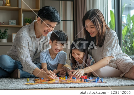 Enjoying Family Bonding Moments Over Board Games in a Cozy and Inviting Living Room Space 128342005