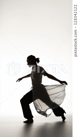 Dynamic Dance Movement Captured in Silhouette Against a Light Background for Artistic Expression 128342122
