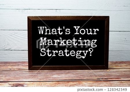 What's your marketing strategy? text written on chalkboard standing on wooden background 128342349