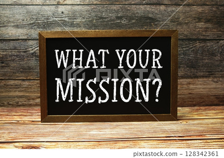 What your mission? text with blackboard on wooden background What your mission? text with blackboard on wooden background 128342361