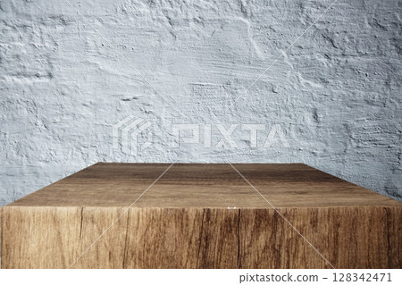 Empty wooden podium stand for display products front of concrete background 128342471