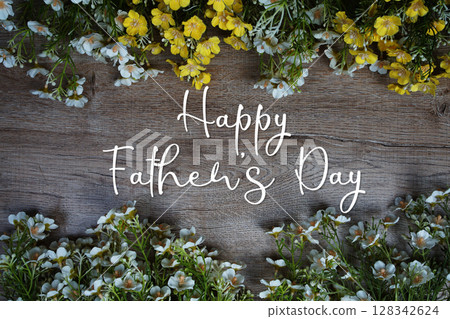 Happy Father's Day text message with flowers decoration on wooden background 128342624