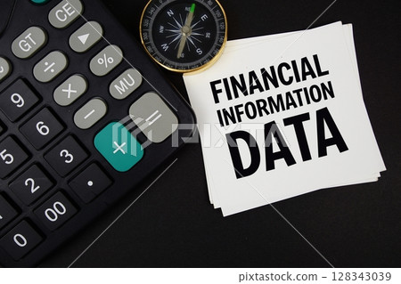 Financial Information Data text with compass and calculator on black background 128343039