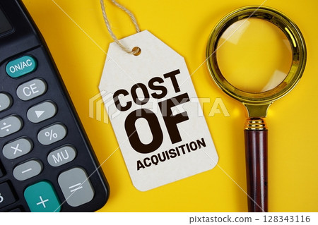 Cost Of Acquisition text on price tag with magnifying glass and calculator on yellow background Cost Of Acquisition text on price tag with magnifying glass and calculator on yellow background 128343116