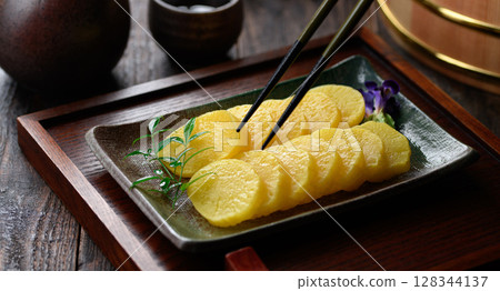 A great supporting role in Japanese cuisine: elegantly arranged slices of pickled radish 128344137
