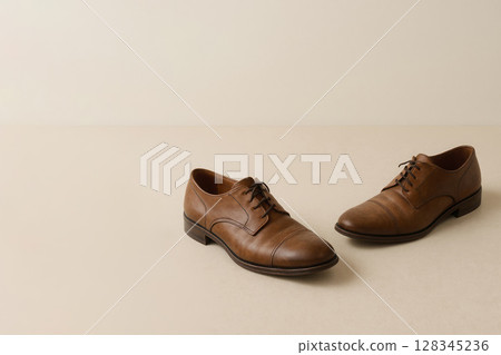 A pair of classic boots on a light background. Space for text. 128345236