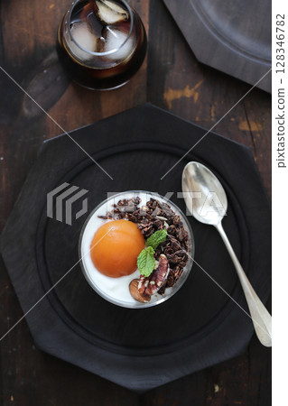 Yogurt with apricots and granola 128346782