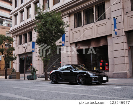 A shiny black sports car 128346977