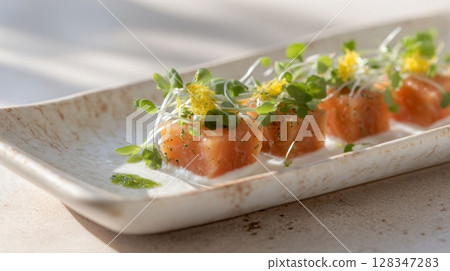 Candied salmon garnished with microgreens and citrus zest on a rustic plate, showcasing a vibrant culinary presentation for gourmet dining 128347283