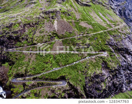 Troll's Path Trollstigen or Trollstigveien winding mountain road. 128347763