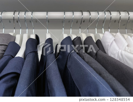 Close up shirts or business clothes on hangers Close up shirts or business clothes on hangers 128348554