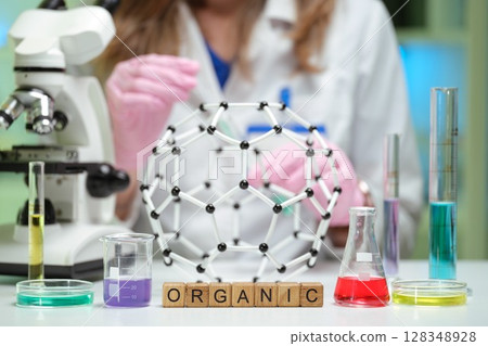 Engaging in Organic Chemistry Research involving Molecular Models and various Laboratory Equipment Engaging in Organic Chemistry Research involving Molecular Models and various Laboratory Equipment 128348928