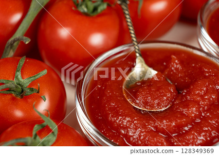 Tomato Paste in Small Glass Bowls. Close-Up of Cooking Ingredient. Tomato Paste in Small Glass Bowls. Close-Up of Cooking Ingredient. 128349369