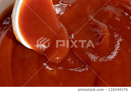 Macro of Ketchup in Spoon. Natural Red Sauce Close-Up Macro of Ketchup in Spoon. Natural Red Sauce Close-Up 128349376