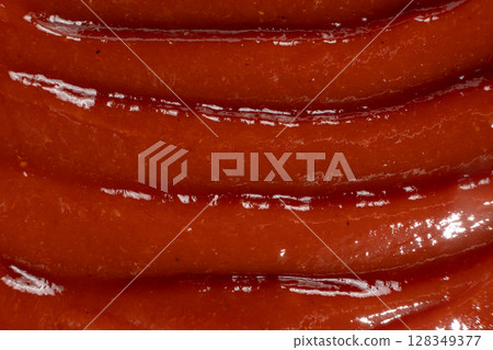 Macro texture of ketchup, natural traditional tomato sauce, top view, culinary background. 128349377
