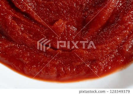 Organic Tomato Paste Close-Up. Smooth Red Spread for Cooking. 128349379