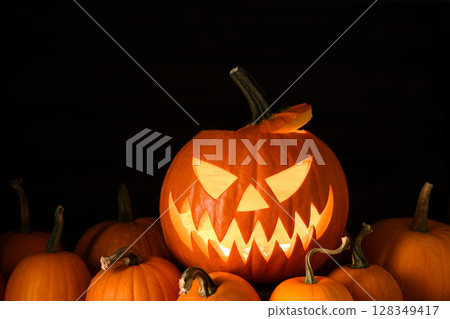 Glowing jack-o'-lantern lit from inside 128349417
