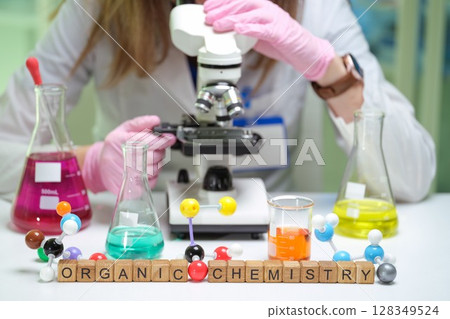 In the Organic Chemistry Lab, we perform experiments using a microscope and vibrant chemicals In the Organic Chemistry Lab, we perform experiments using a microscope and vibrant chemicals 128349524