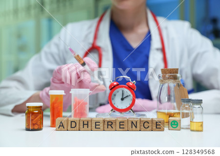 Healthcare Professional Focused on Promoting Medication Adherence for Better Patient Outcomes Healthcare Professional Focused on Promoting Medication Adherence for Better Patient Outcomes 128349568