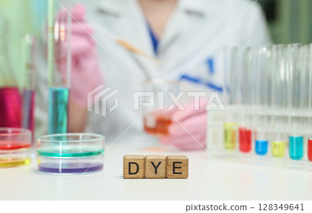 Conducting a Chemical Dye Experiment in a Laboratory with Various Colorful Solutions and Samples Conducting a Chemical Dye Experiment in a Laboratory with Various Colorful Solutions and Samples 128349641