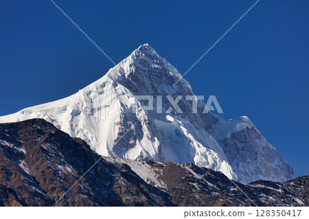 Shispare Sar is one of the high mountain peaks of the Batura Muztagh, the westernmost subrange of the Karakoram range in the Gilgit-Baltistan region of Pakistan, 128350417