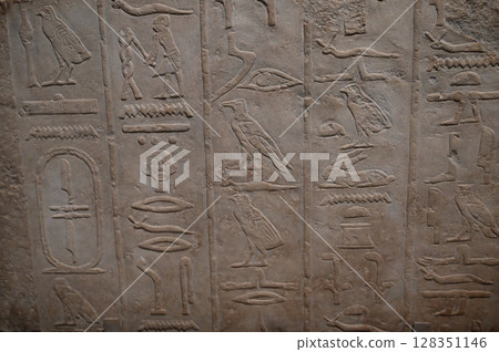 Hieroglyphs carved in relief 128351146