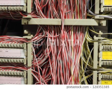 Building MDF: The main distribution board for in-house telephones, the nerve center of analog communications, the complex telephone wiring, and the back side of information infrastructure 128351385