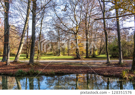 Golden autumn view in famous Munich relax place - Englischer Garten. Munich, Bavaria, Germany Golden autumn view in famous Munich relax place - Englischer Garten. Munich, Bavaria, Germany 128351576