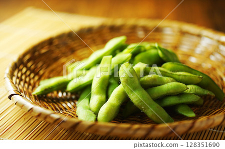 Boiled edamame beans served in a mesh strainer Boiled edamame beans served in a mesh strainer 128351690
