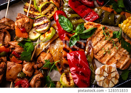 Assortment of grilled bbq meat and vegetables 128351833