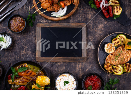 Assortment of grilled bbq meat and vegetables Assortment of grilled bbq meat and vegetables 128351839