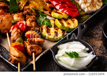 Assortment of grilled bbq meat and vegetables 128351844