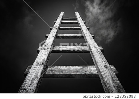 Black and white image of a wooden staircase leading high into the sky. Generated by artificial intelligence 128352098