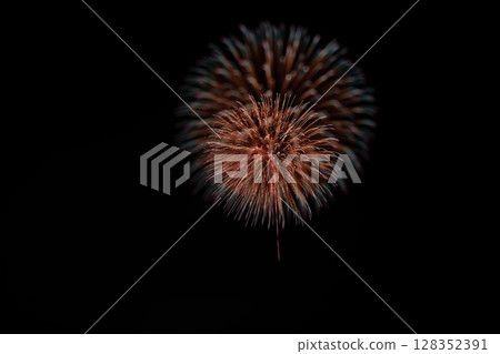 Large fireworks blooming in the summer night sky Large fireworks blooming in the summer night sky 128352391