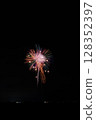 Large fireworks blooming in the summer night sky 128352397
