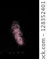 Large fireworks blooming in the summer night sky 128352401