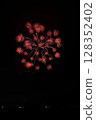 Large fireworks blooming in the summer night sky 128352402