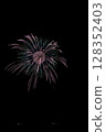 Large fireworks blooming in the summer night sky 128352403