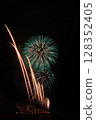 Large fireworks blooming in the summer night sky 128352405