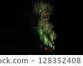 Large fireworks blooming in the summer night sky 128352408