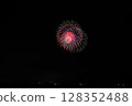 Large fireworks blooming in the summer night sky 128352488