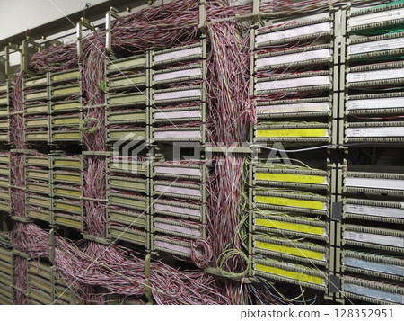 A key point in the network, a communications hub woven with countless cables 128352951