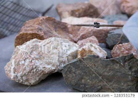red and black mountain and river stones of different sizes red and black mountain and river stones of different sizes 128353179