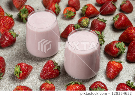 Freshly made sweet strawberry milkshake with milk, ice cream and strawberries. Freshly made sweet strawberry milkshake with milk, ice cream and strawberries. 128354632