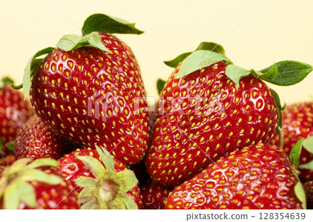 Ripe strawberries background. Sweet seasonal fruit concept. Ripe strawberries background. Sweet seasonal fruit concept. 128354639